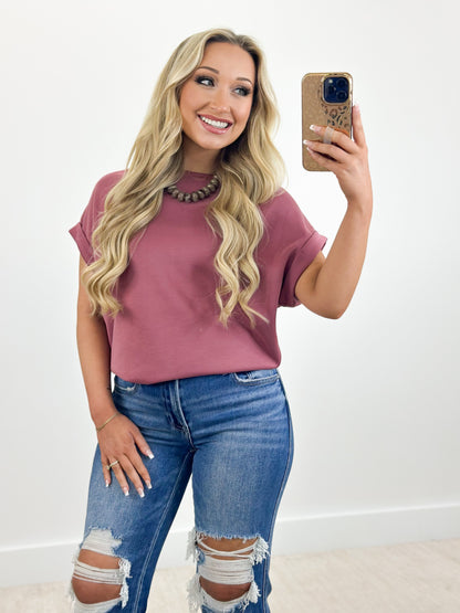 Dark mauve cuffed sleeve dolman top in scuba knit with crew neckline