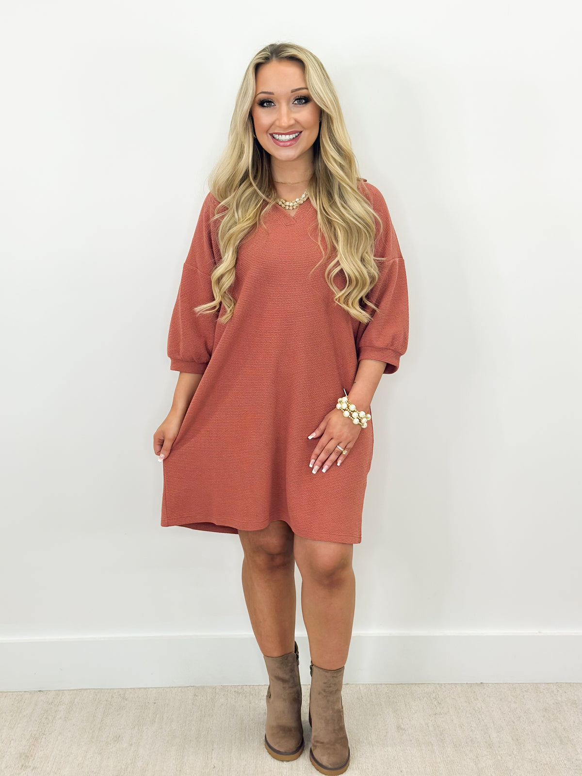 Dusty mauve knit collar dress with half sleeves and curved hem, above-knee