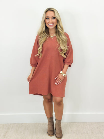 Dusty mauve knit collar dress with half sleeves and curved hem, above-knee