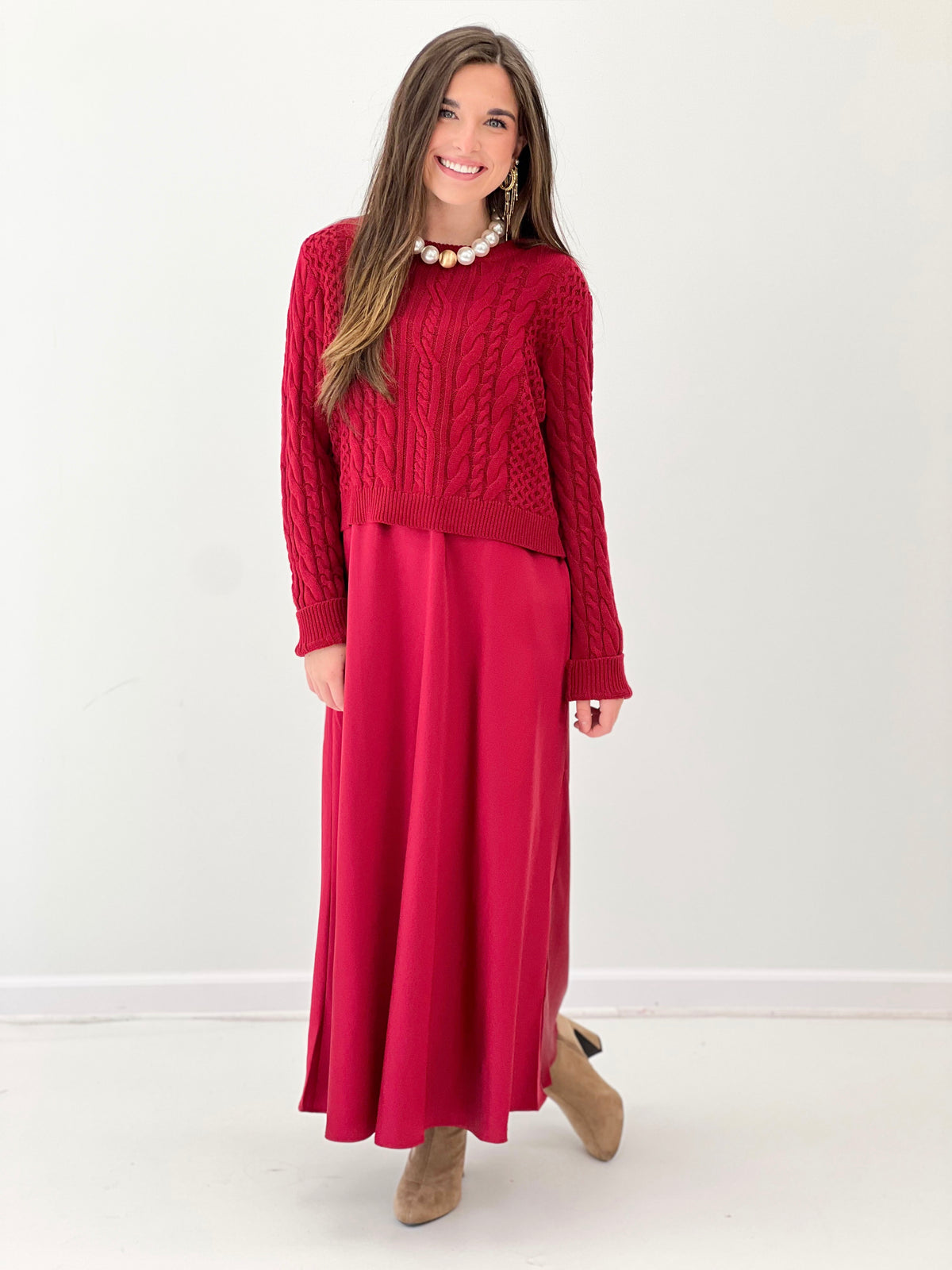 Burgundy knit sweater dress with cable texture top and full midi skirt.