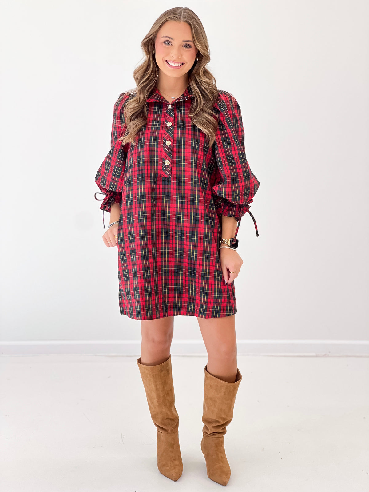 Red plaid collared mini dress with balloon sleeves, button front, and gathered cuffs.