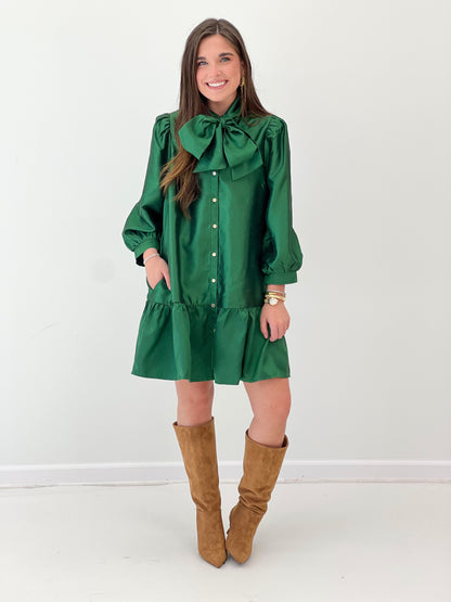 Green button-front mini dress with bow neckline, puff sleeves, ruffled tier hem