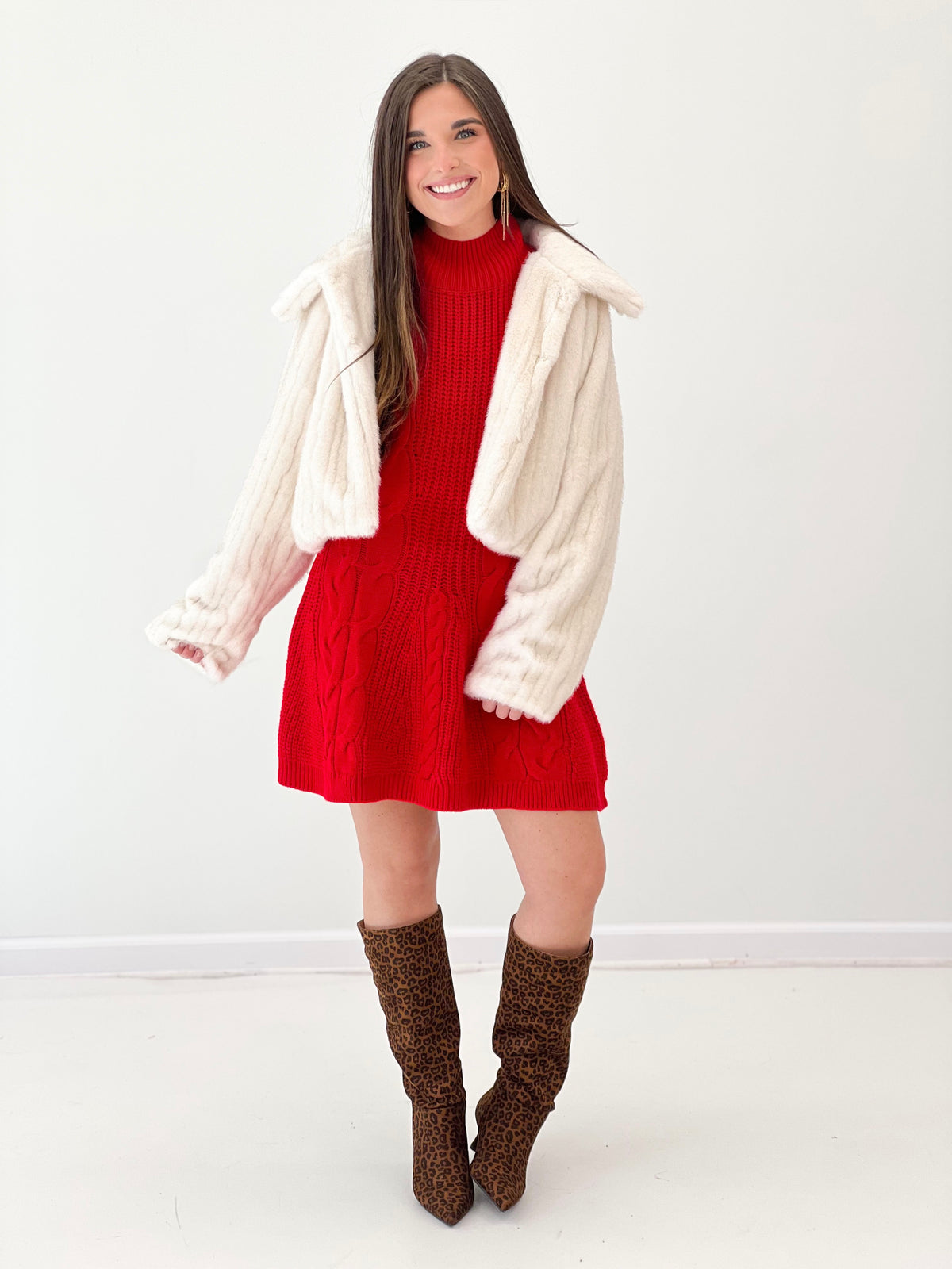 Cream faux fur crop jacket with fluffy cuffs, open front and long sleeves (front view)