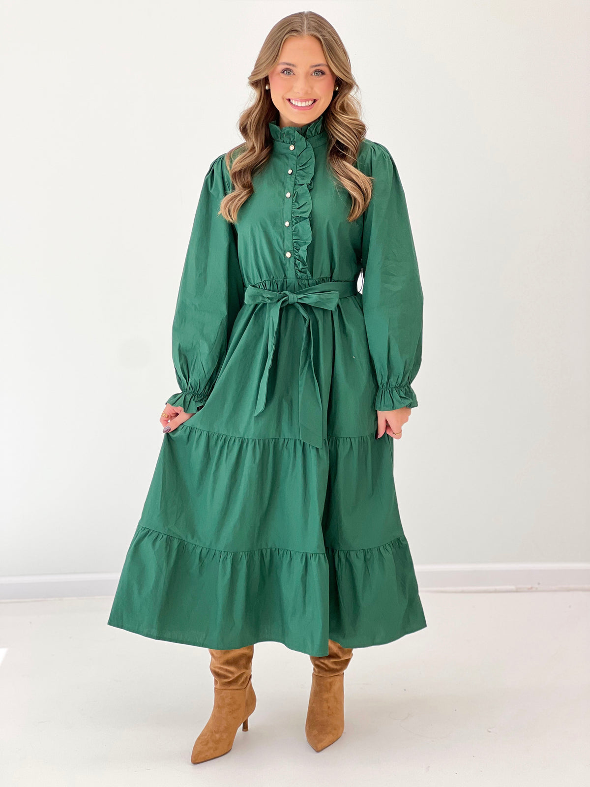 Hunter green tiered button-up midi dress with ruffle bib, puff sleeves, and tie waist