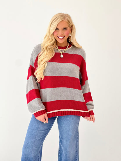 Oversized striped crew neck sweater in red and gray with ribbed hem and cuffs