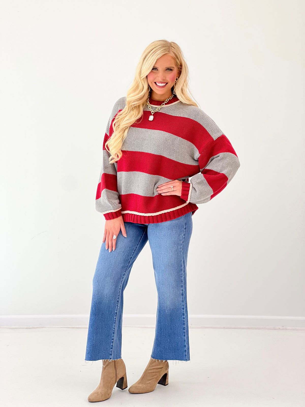 Oversized crew neck long sleeve sweater in red and gray wide stripes with ribbed knit