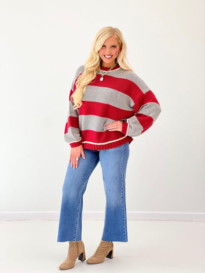 Oversized crew neck long sleeve sweater in red and gray wide stripes with ribbed knit