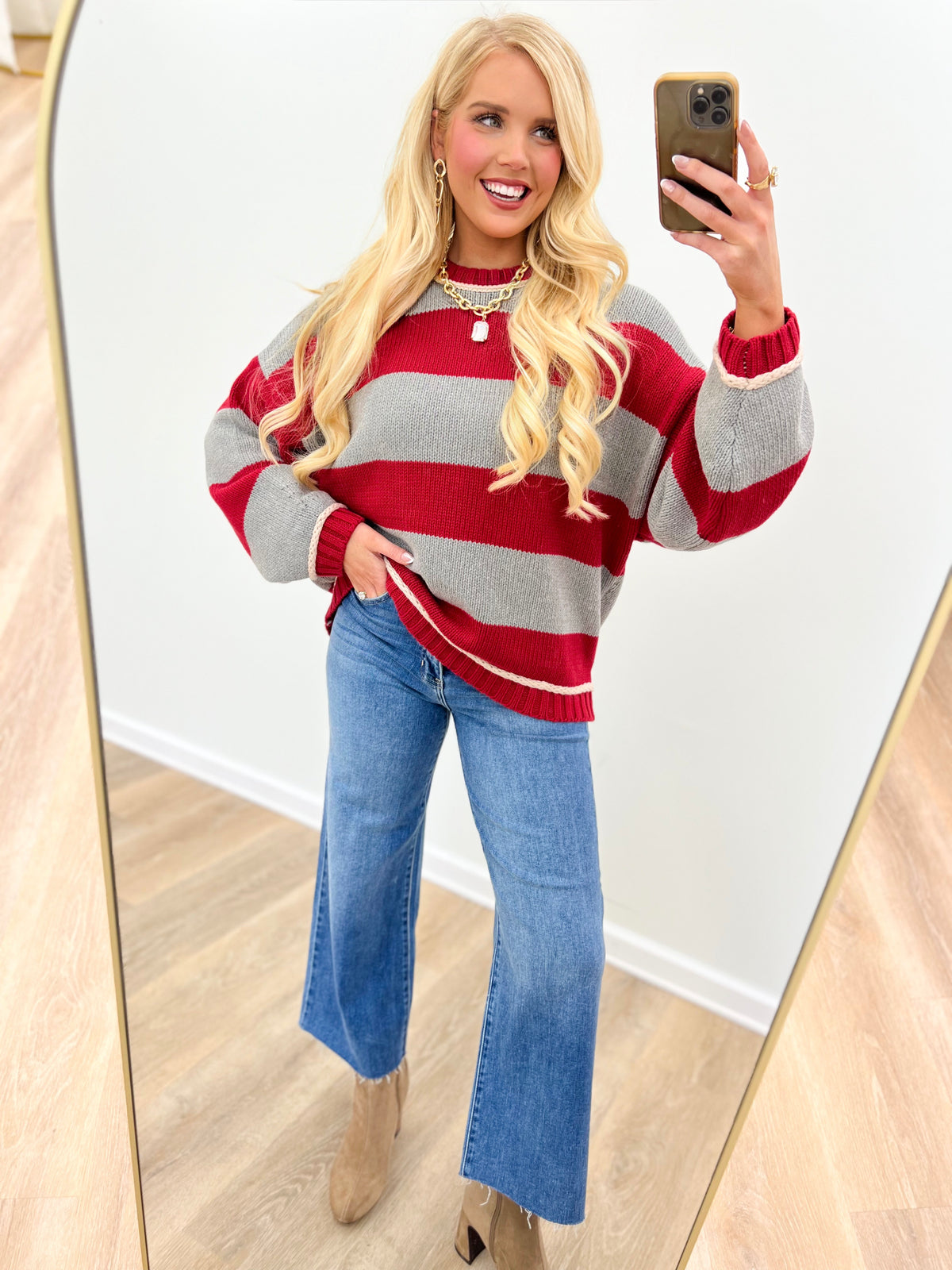 Oversized crew neck long sleeve sweater in red and gray with wide horizontal stripes