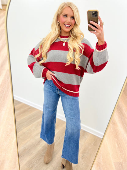 Oversized crew neck long sleeve sweater in red and gray with wide horizontal stripes