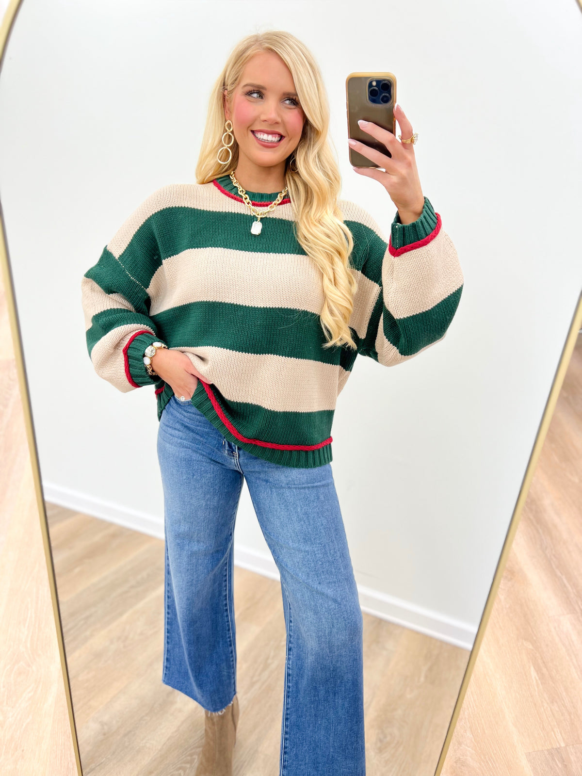 Oversized crew neck long sleeve sweater in green and cream with wide horizontal stripes