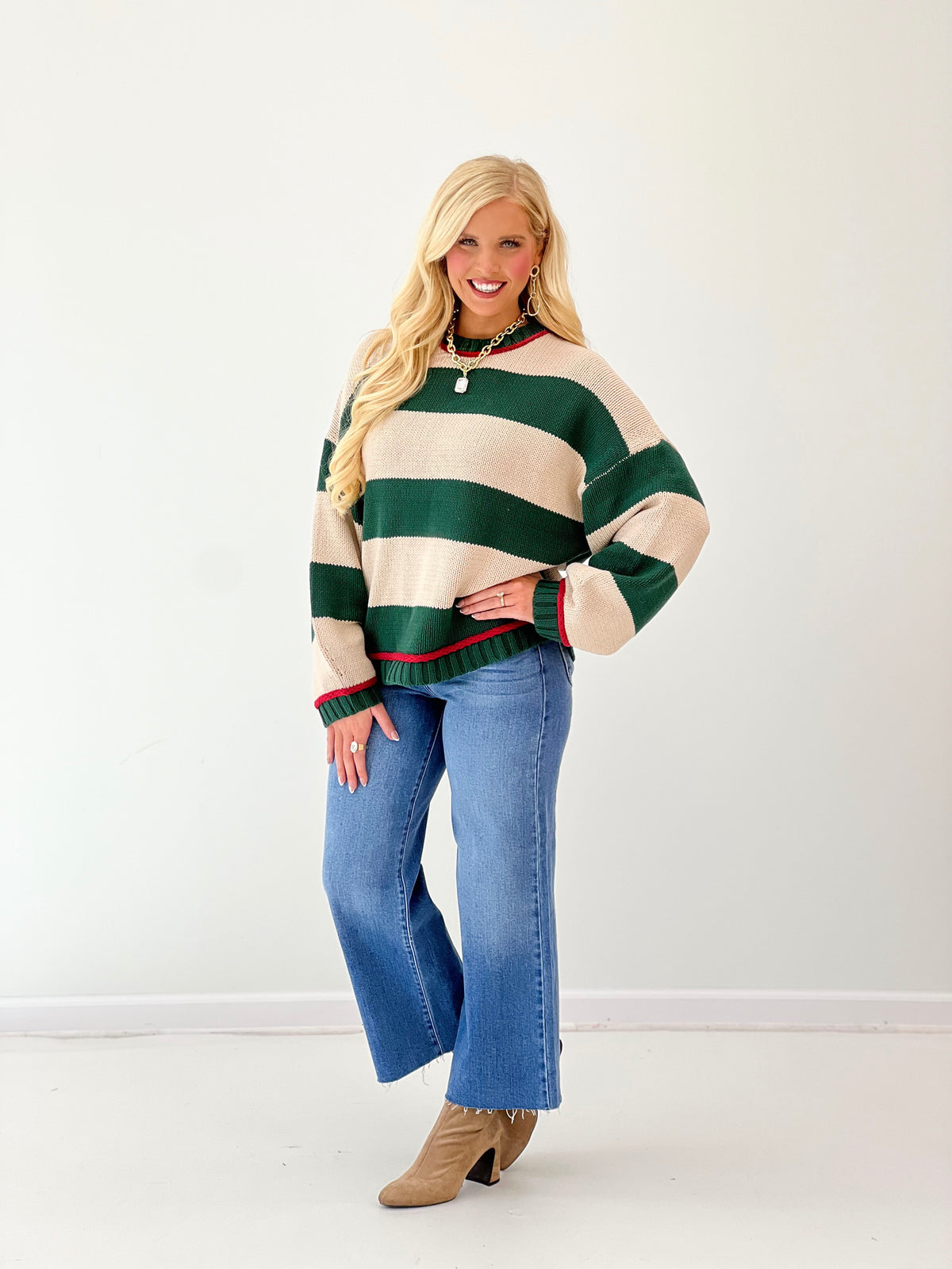 Oversized crew neck long sleeve sweater in green and cream with bold horizontal stripes
