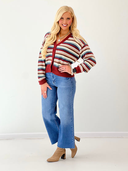 Cropped button-front cardigan with multicolor stripes and burgundy V-neck, long sleeves