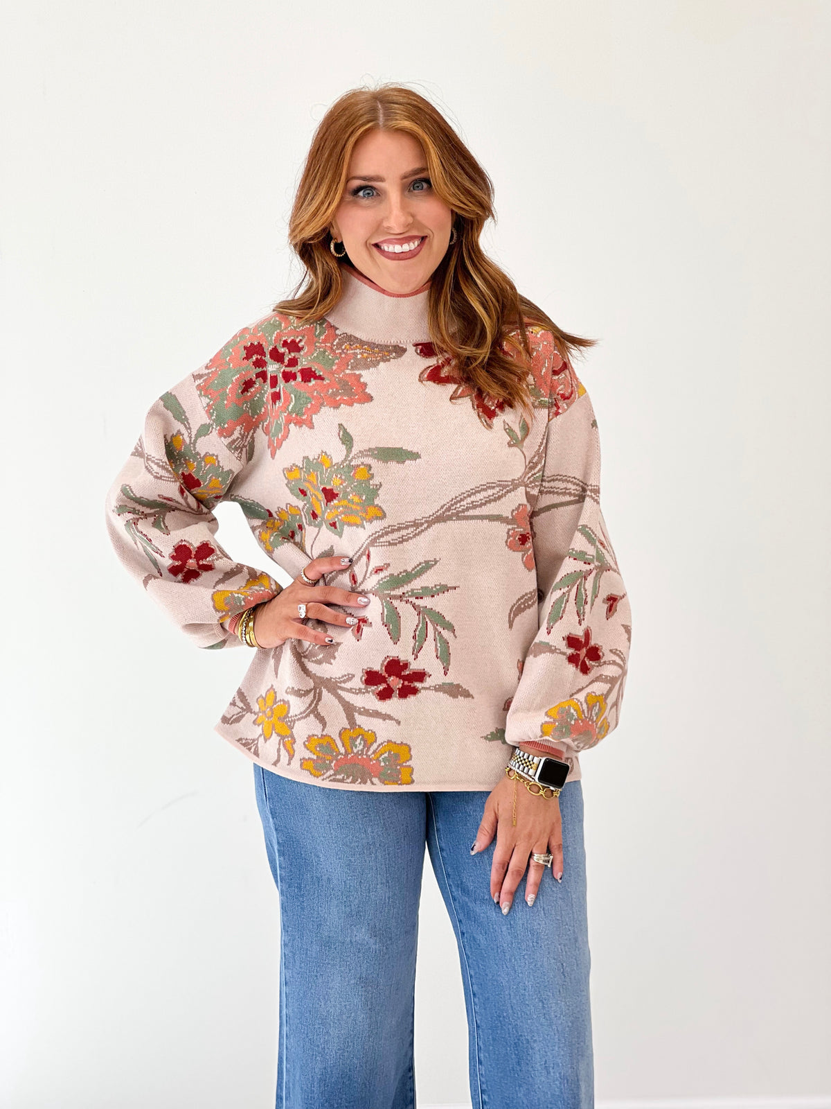 Beige floral jacquard mock neck sweater with long cuffed sleeves and crew neckline
