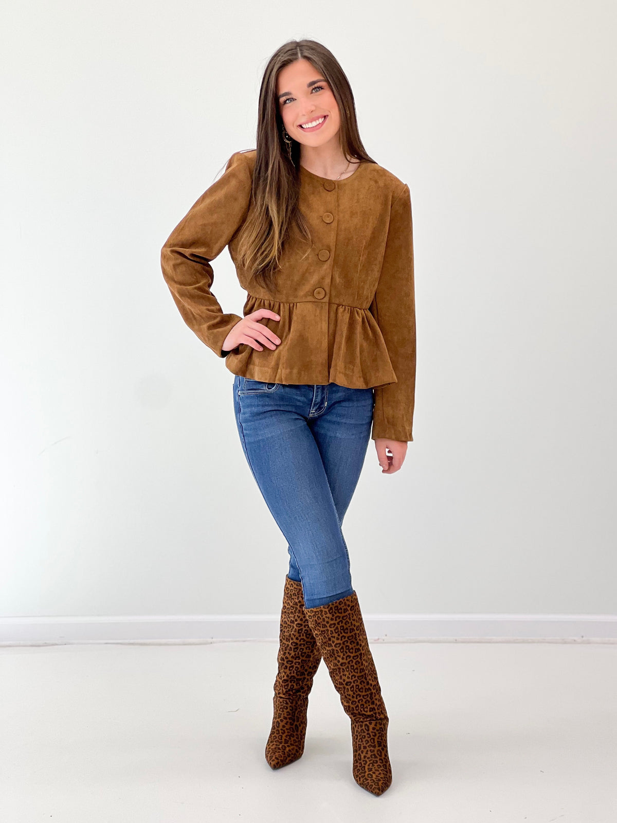 Camel peplum button-front jacket with long sleeves and curved hem