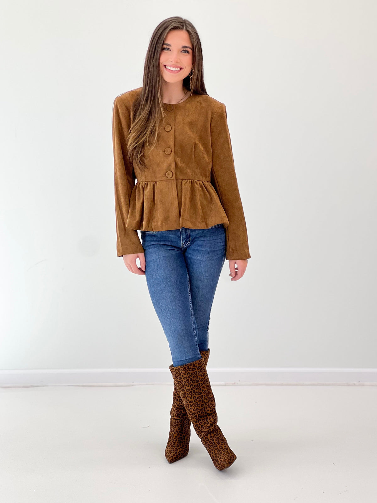 Camel peplum hem button-front jacket with long sleeves and round neckline