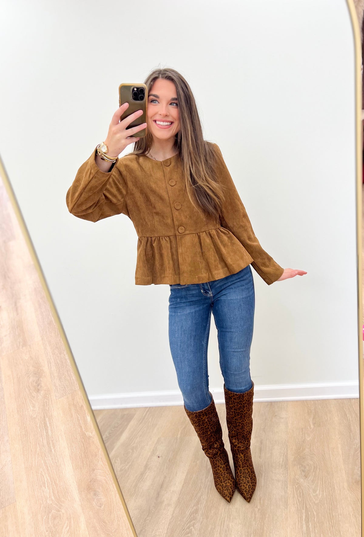 Camel peplum button-front jacket with long sleeves and round neckline