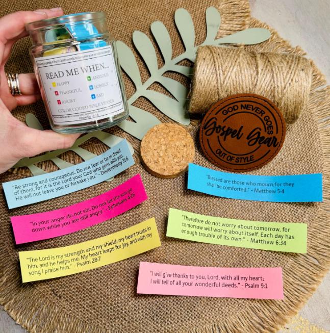 Read Me When Bible Verse Scripture Jar with six colors of scripture papers laid out