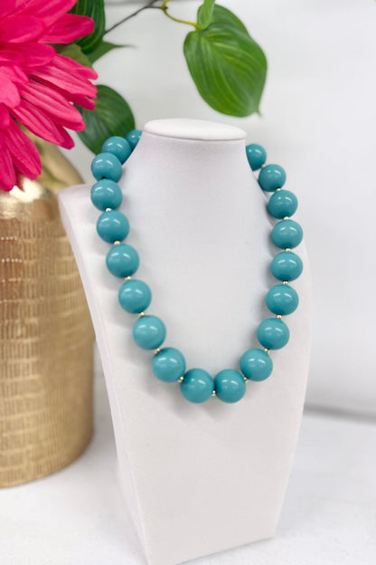 Chain necklace strung with colored acrylic balls