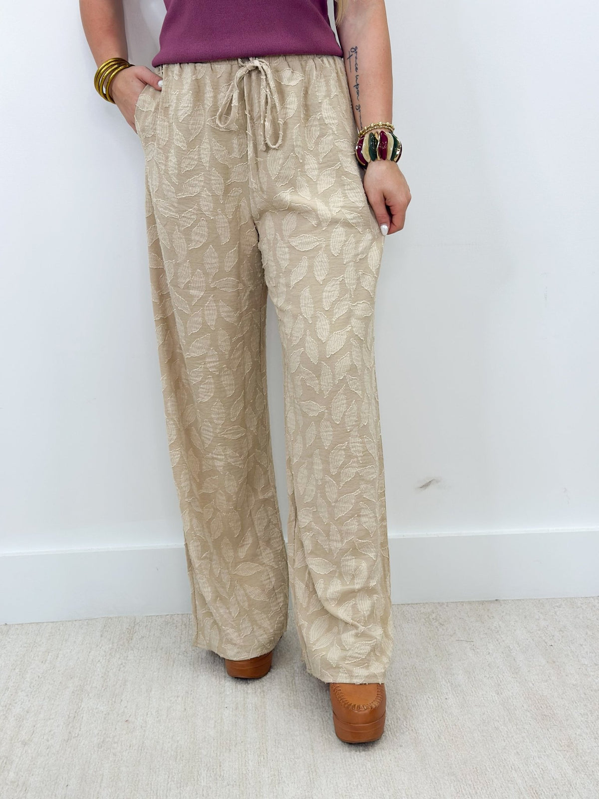 Taupe pull on pants with a drawstring tie waistband