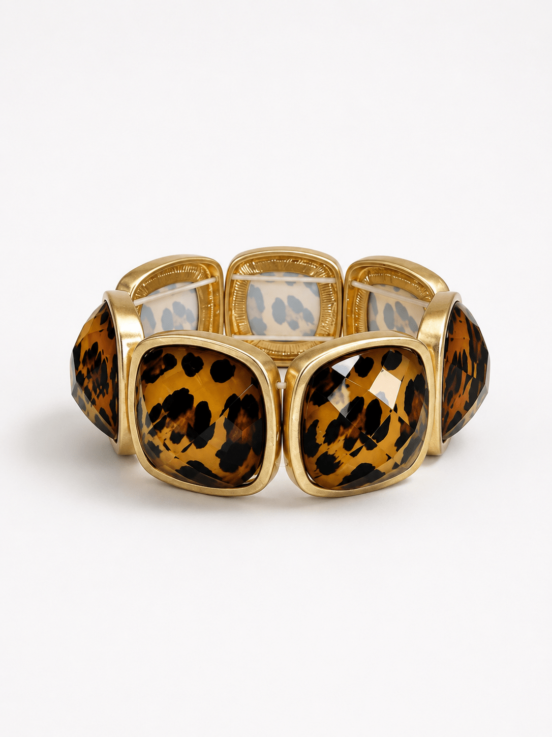 Faceted beads in a leopard pattern with gold accents