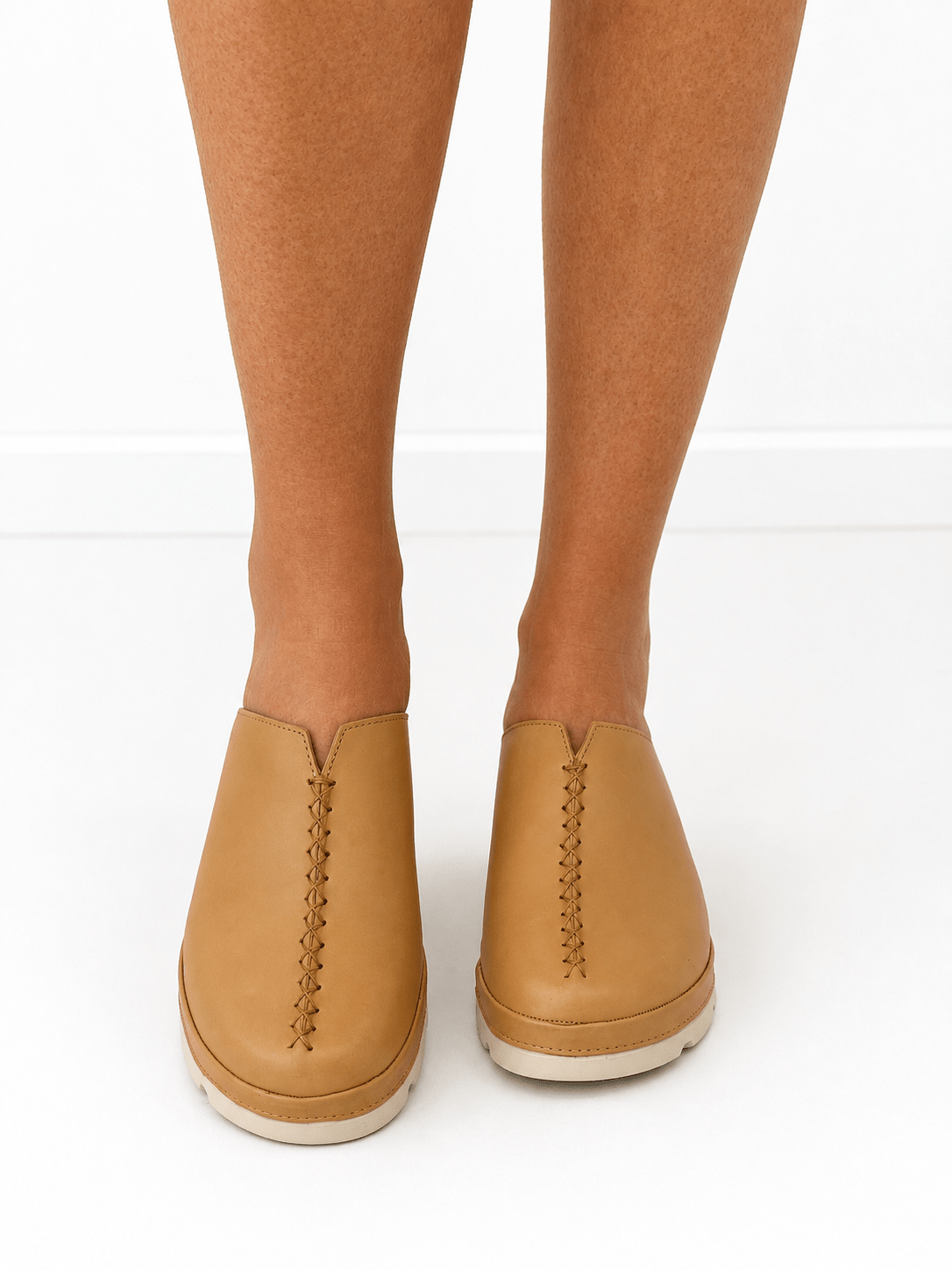 Leather slide mule with an open back and wedge heel
