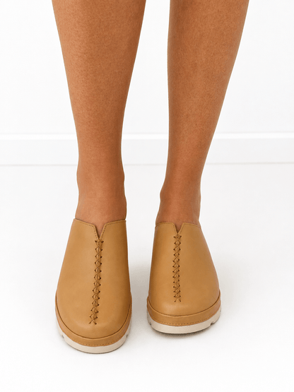 Leather slide mule with an open back and wedge heel