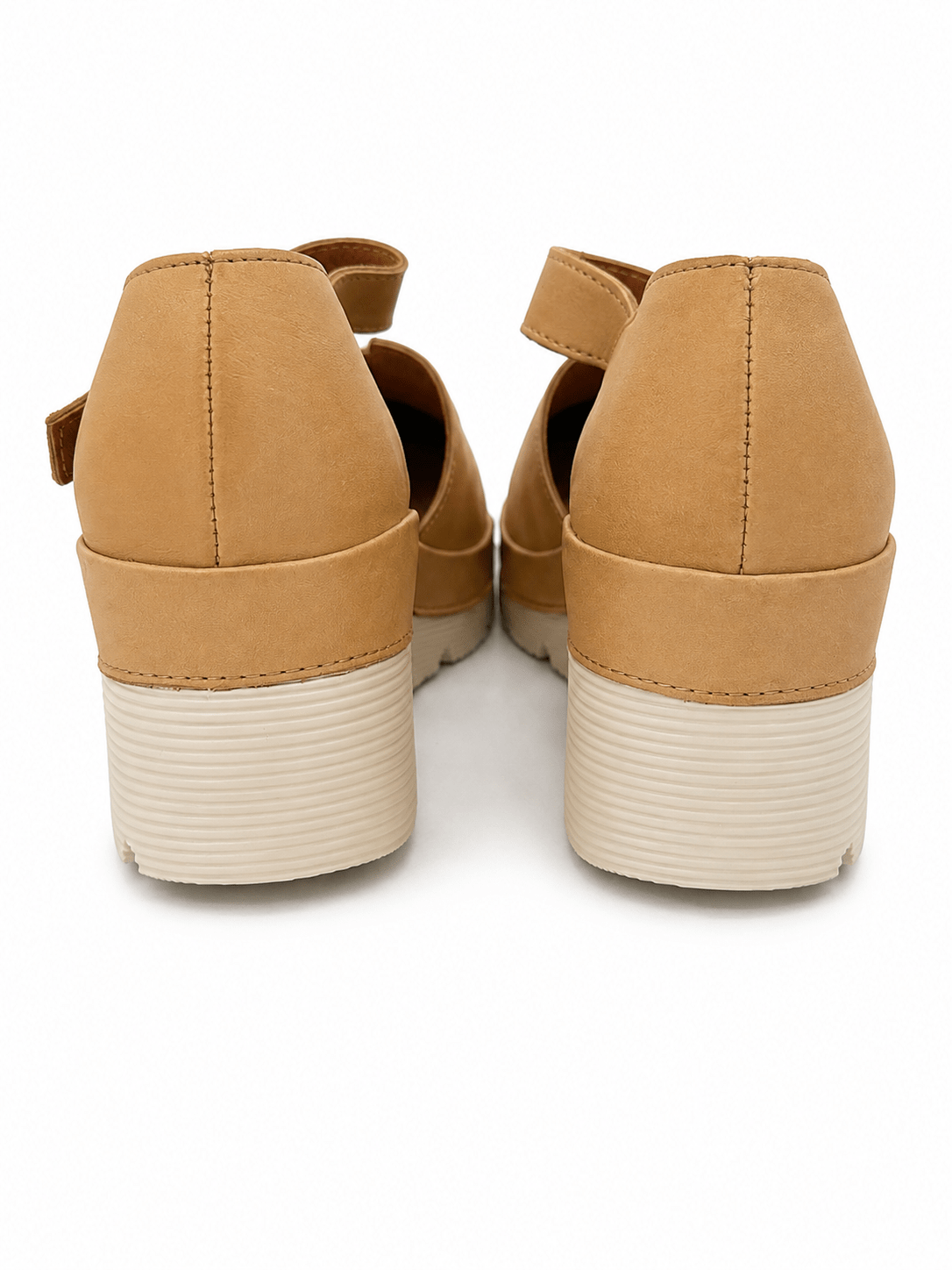 Clog with a buckled ankle strap and platform sole