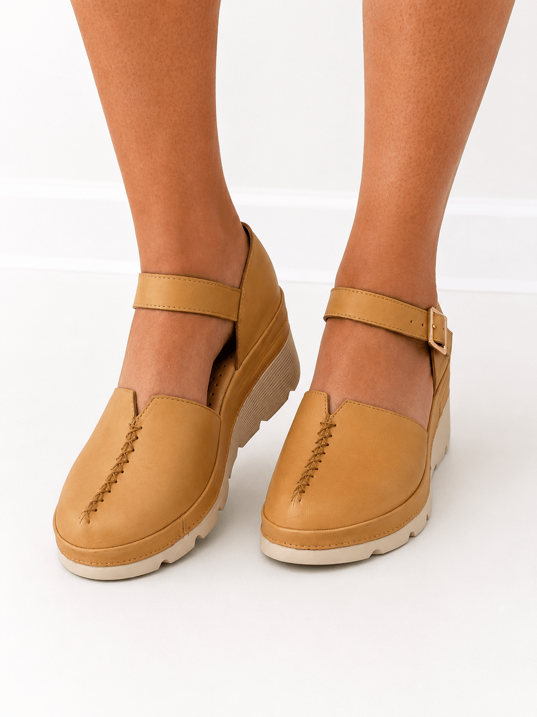 Clog with an adjustable ankle strap and block heel