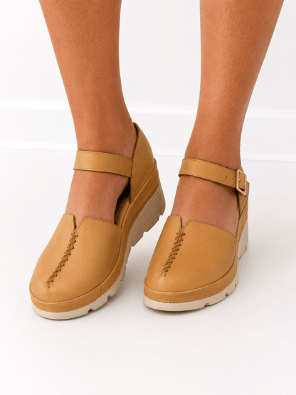Clog with an adjustable ankle strap and block heel