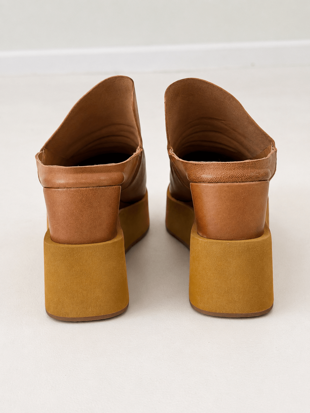 Ruched leather slide in tan with a chunky platform