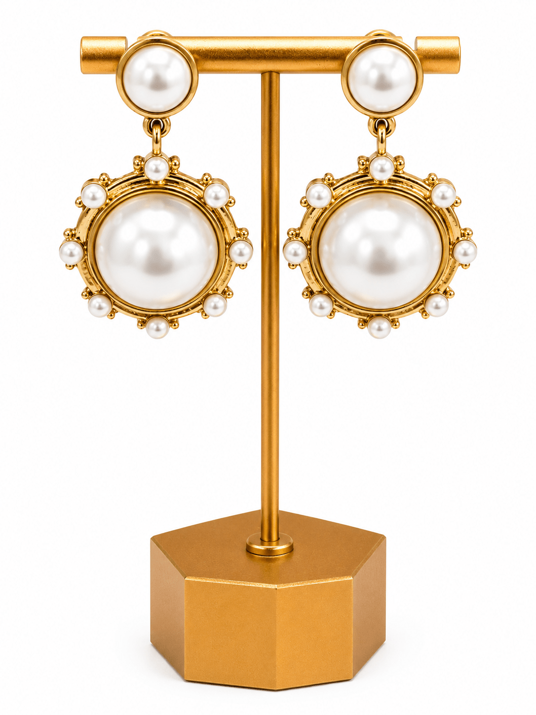 Antique gold earrings with a cream pearl drop