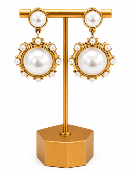 Antique gold earrings with a cream pearl drop