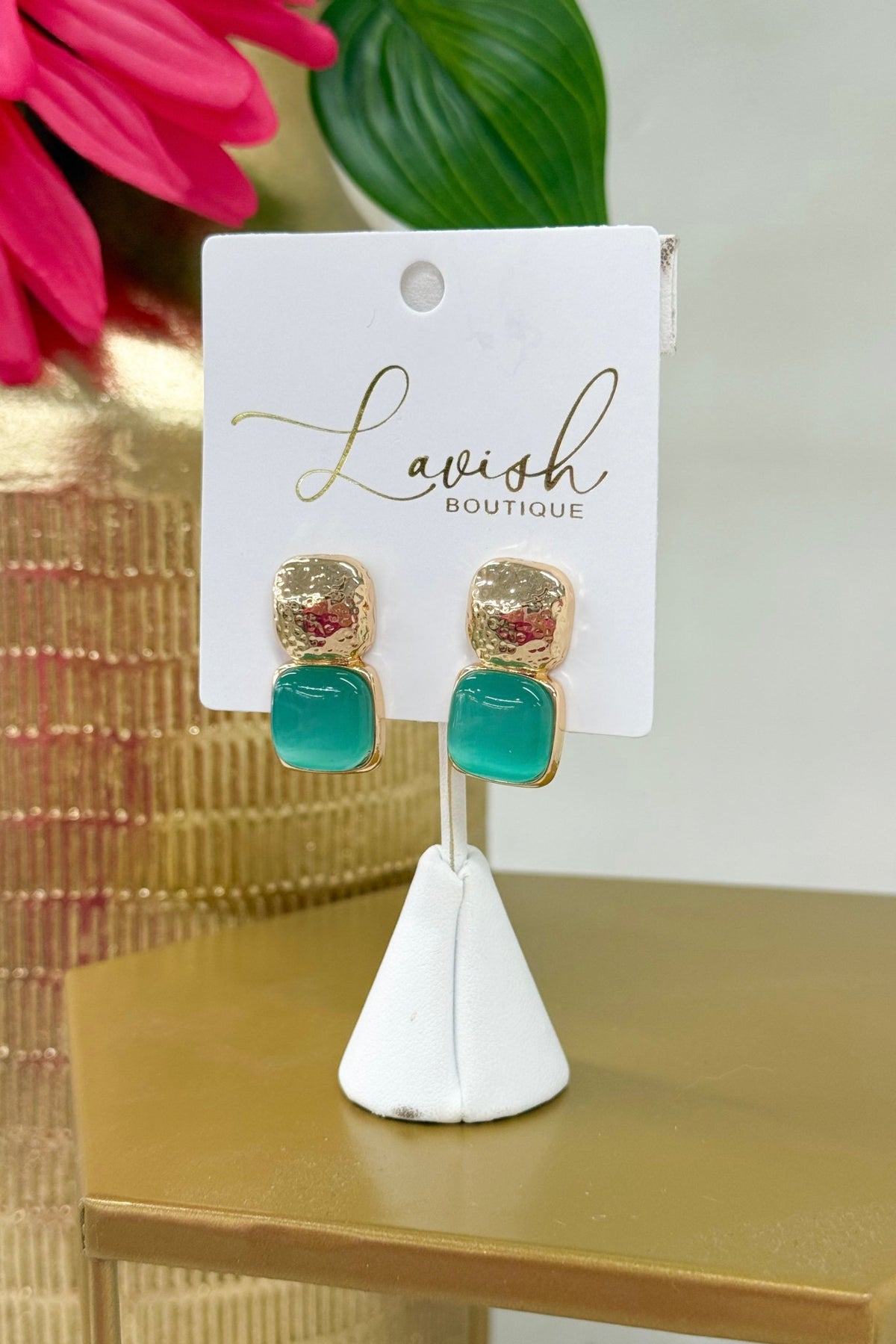 Aqua cat eye stones set in chunky gold earrings