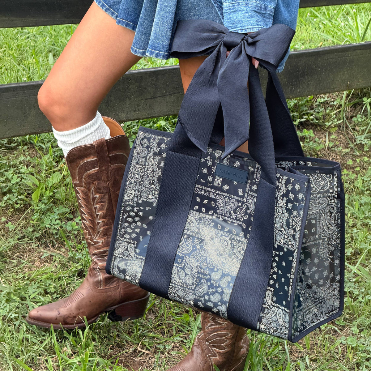 Paisley-pattern navy jelly tote bag with long bow and patterned side panels.