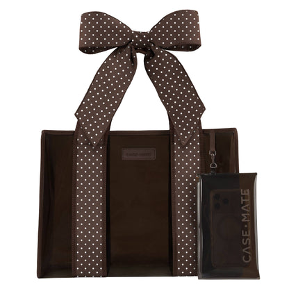Espresso-brown jelly tote bag with white polka-dot ribbon bow and front zip pocket