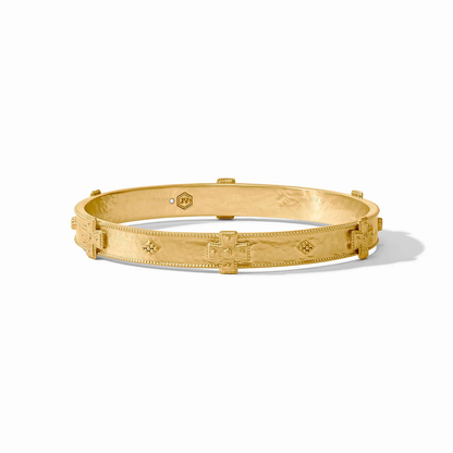 Gold-tone bangle with repeating cross pattern, smooth interior, hinged closure