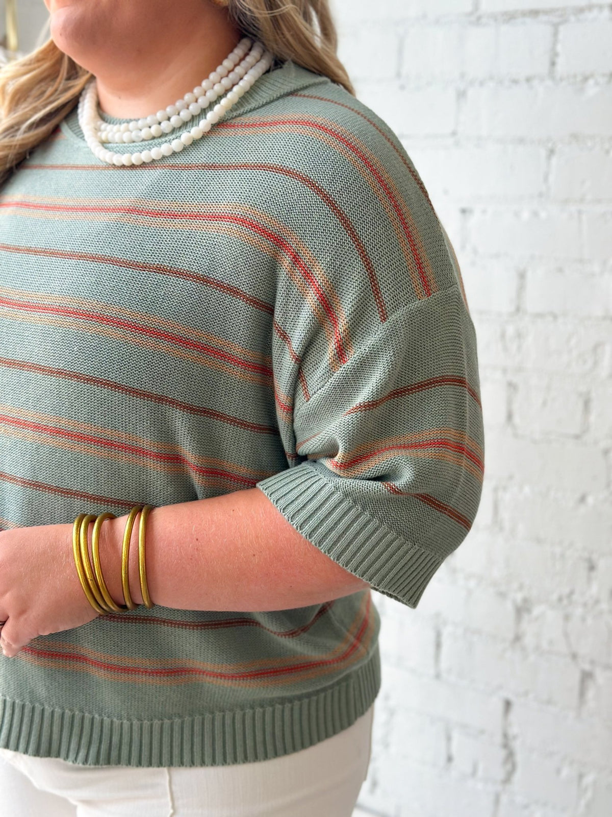 Striped sage knit with dropped sleeve seams