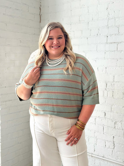 Sage sweater with horizontal stripes and a relaxed body