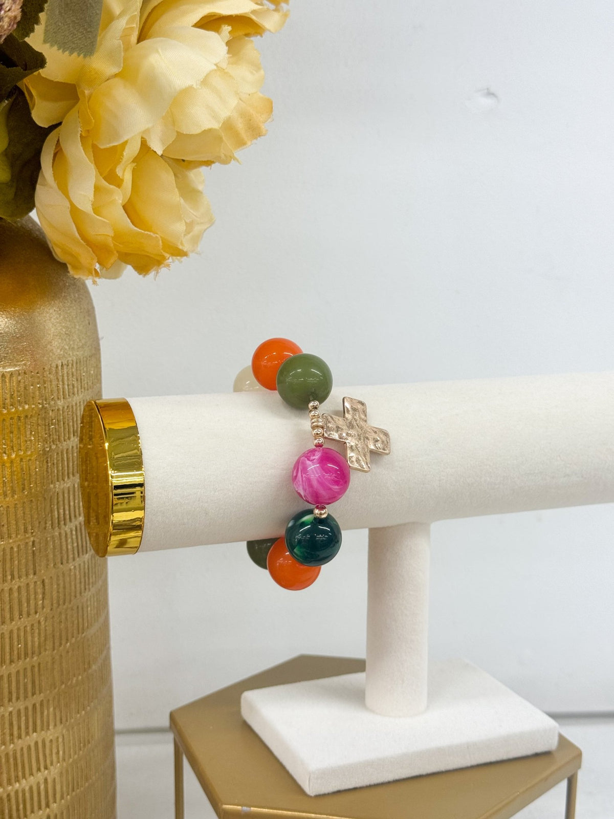 Colorful bead bracelet finished with a cross pendant