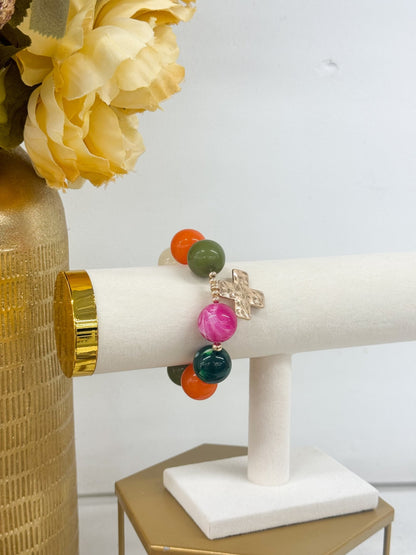 Colorful bead bracelet finished with a cross pendant