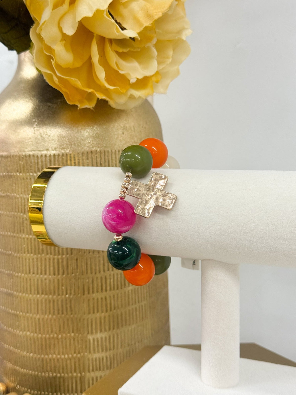 Multicolor beaded bracelet with a cross charm