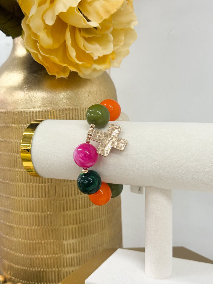 Multicolor beaded bracelet with a cross charm