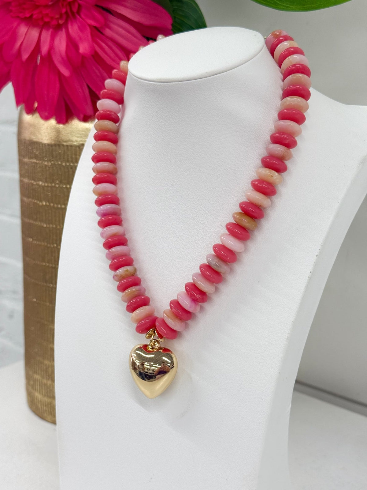 Beaded coral necklace finished with a heart charm