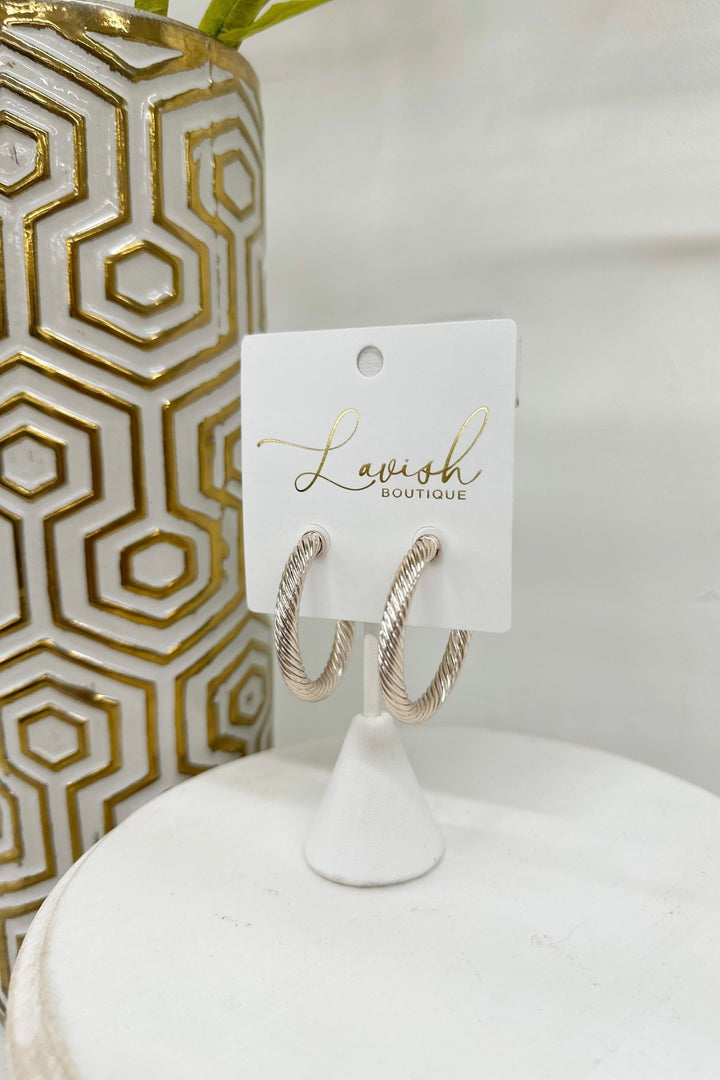 Beige 35mm twisted metal hoop earrings