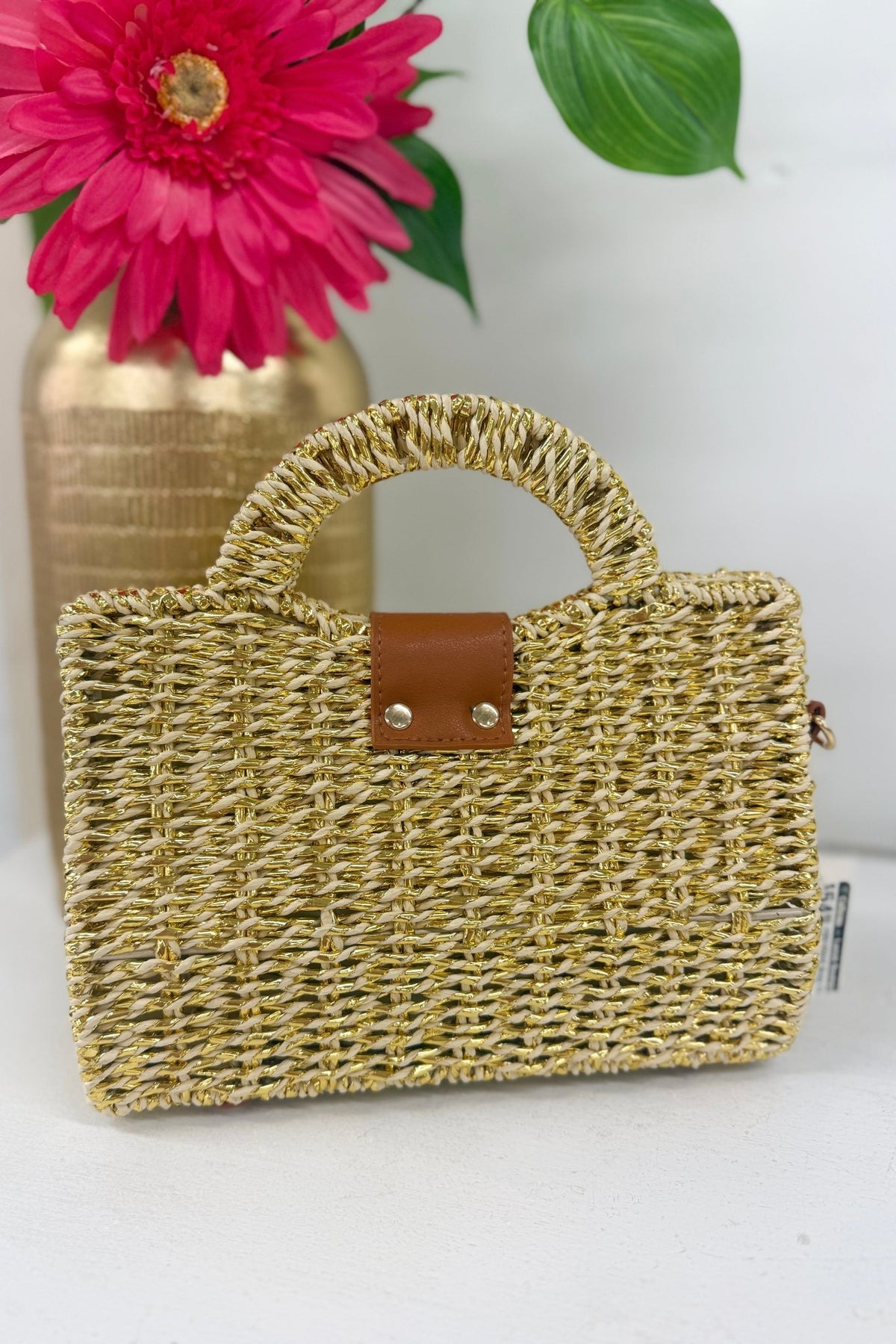 Rectangular beige woven bag with a single top handle