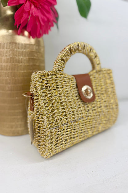 Beige woven top handle bag in a basket weave texture
