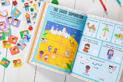 Open activity book with “The Good Samaritan” page and illustrated lesson panels