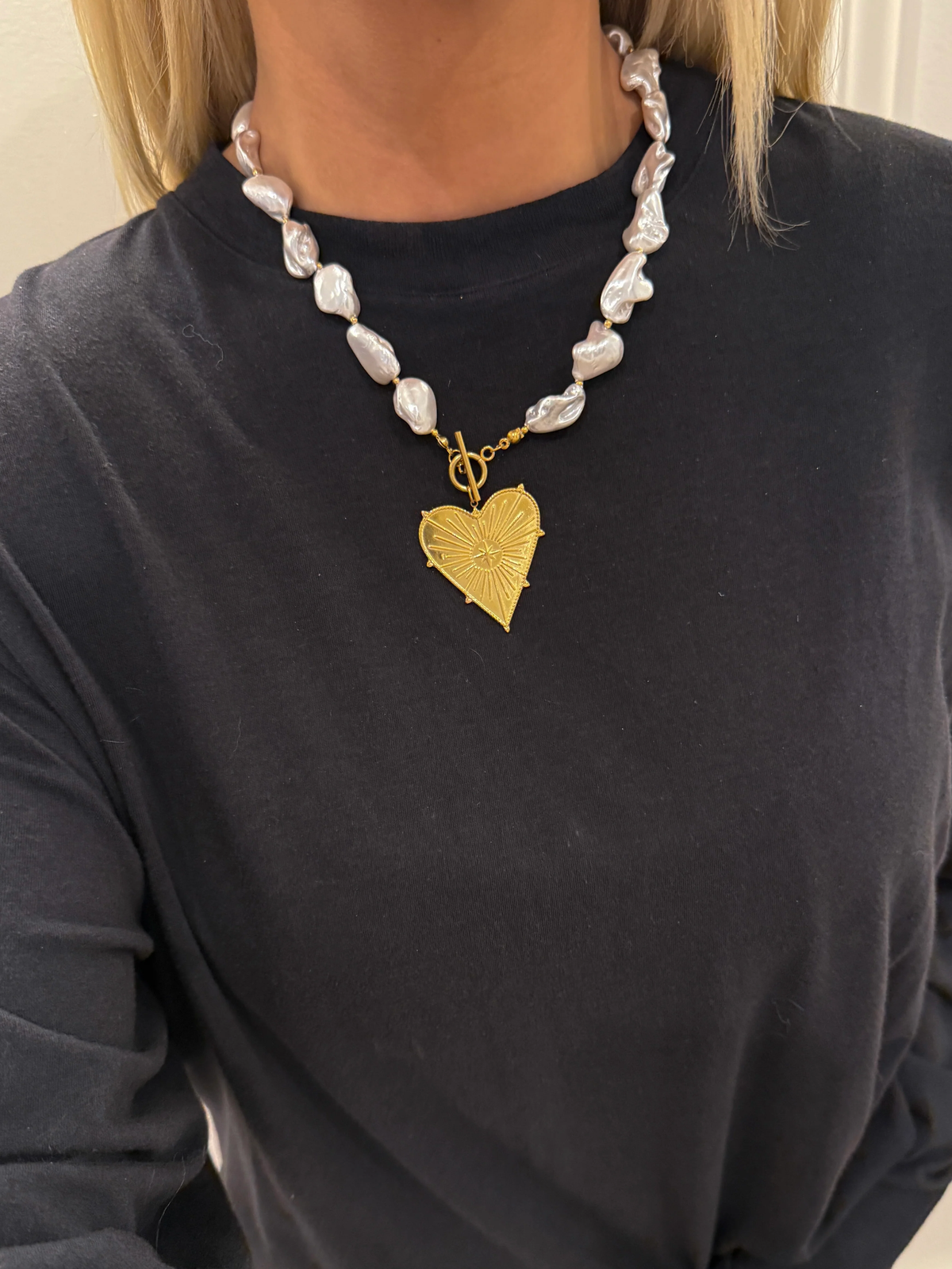 Silver baroque pearl necklace with heart-shaped gold pendant