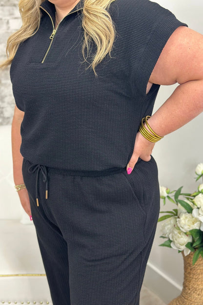 Matching black set with a zip collar top