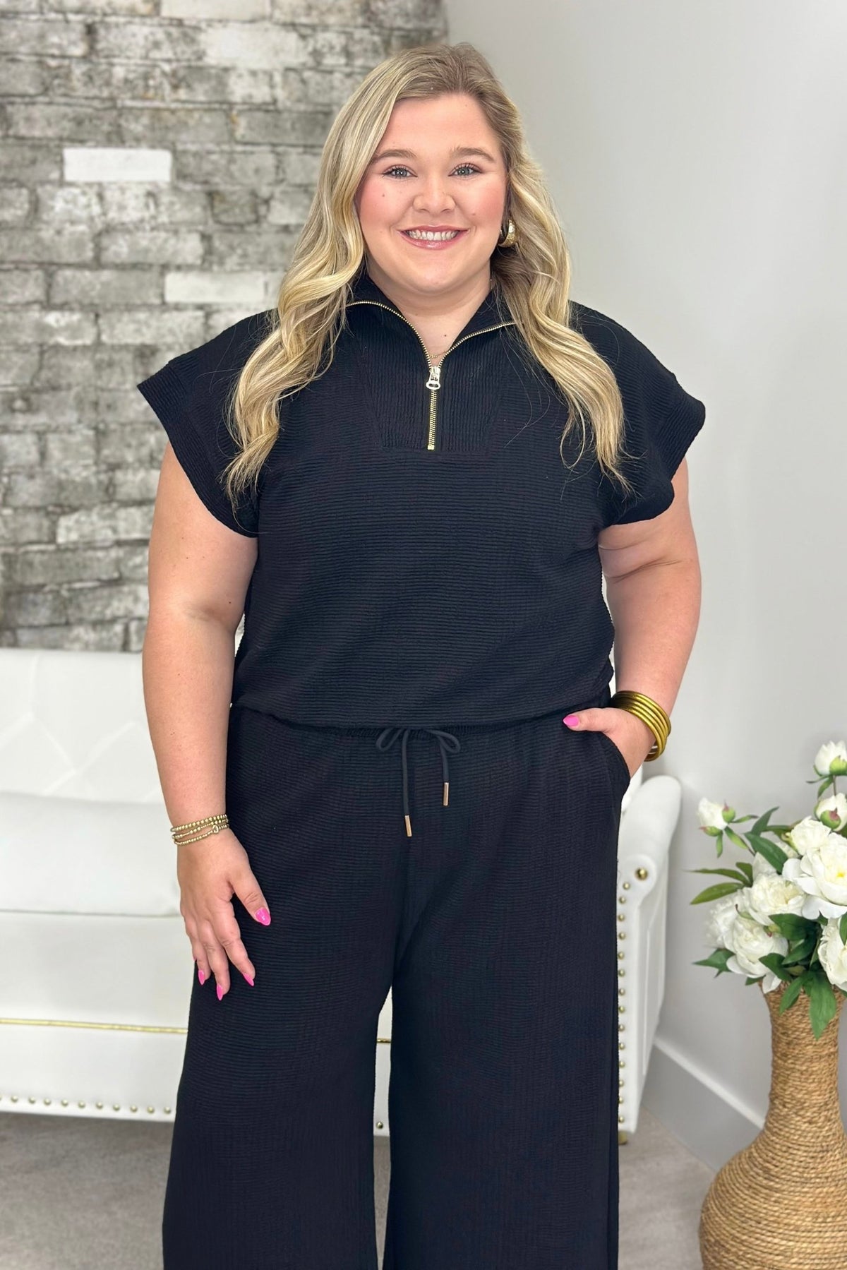 Black half zip mock neck top with matching bottoms